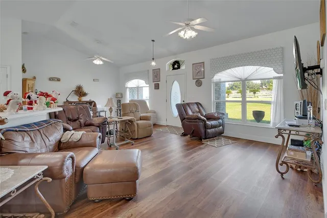 a living room with furniture and a large window