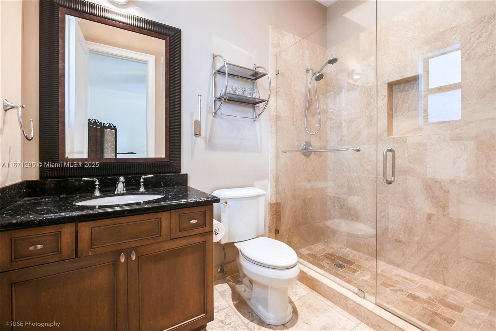 8240 Southwest 98th Street Miami, FL 33156 - Photo 13 of 17 a bathroom with a granite countertop sink toilet and shower