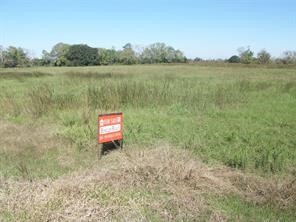 1703 Apache Angleton, TX 77515 - Photo 2 of 4 a sign board with lake view