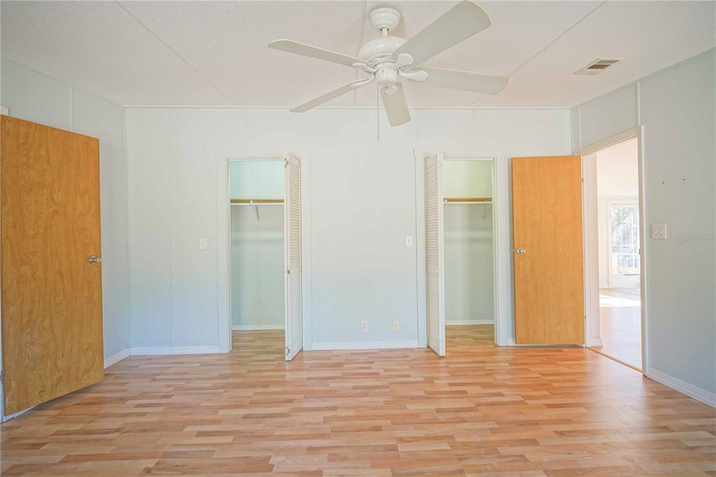 16621 Southwest 45th Street Ocala, FL 34481 - Photo 25 of 52 wooden floor in an empty room with a window