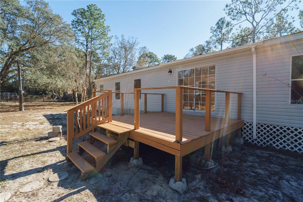 16621 Southwest 45th Street Ocala, FL 34481 - Photo 41 of 52 a roof deck with table and chairs