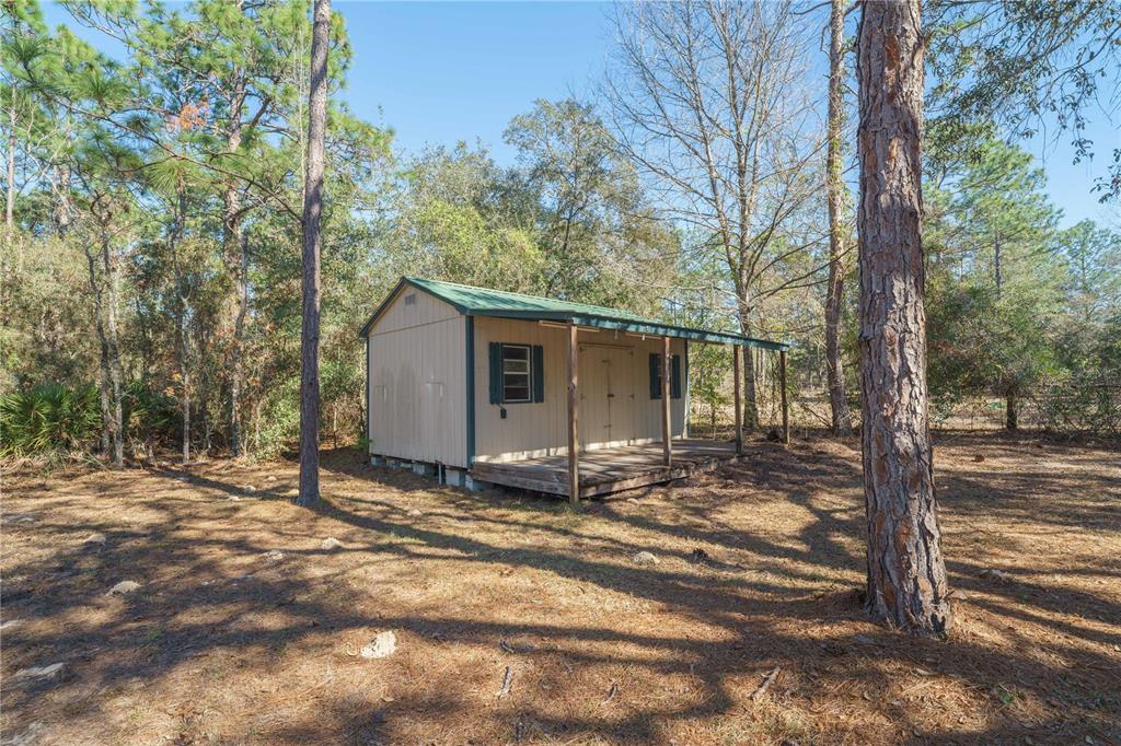 16621 Southwest 45th Street Ocala, FL 34481 - Photo 47 of 52 a view of a house with a tree in the background