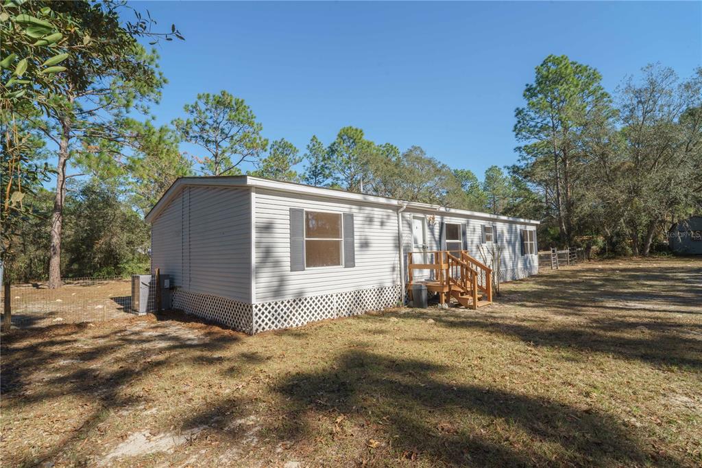 16621 Southwest 45th Street Ocala, FL 34481 - Photo 5 of 52 a view of a house with backyard