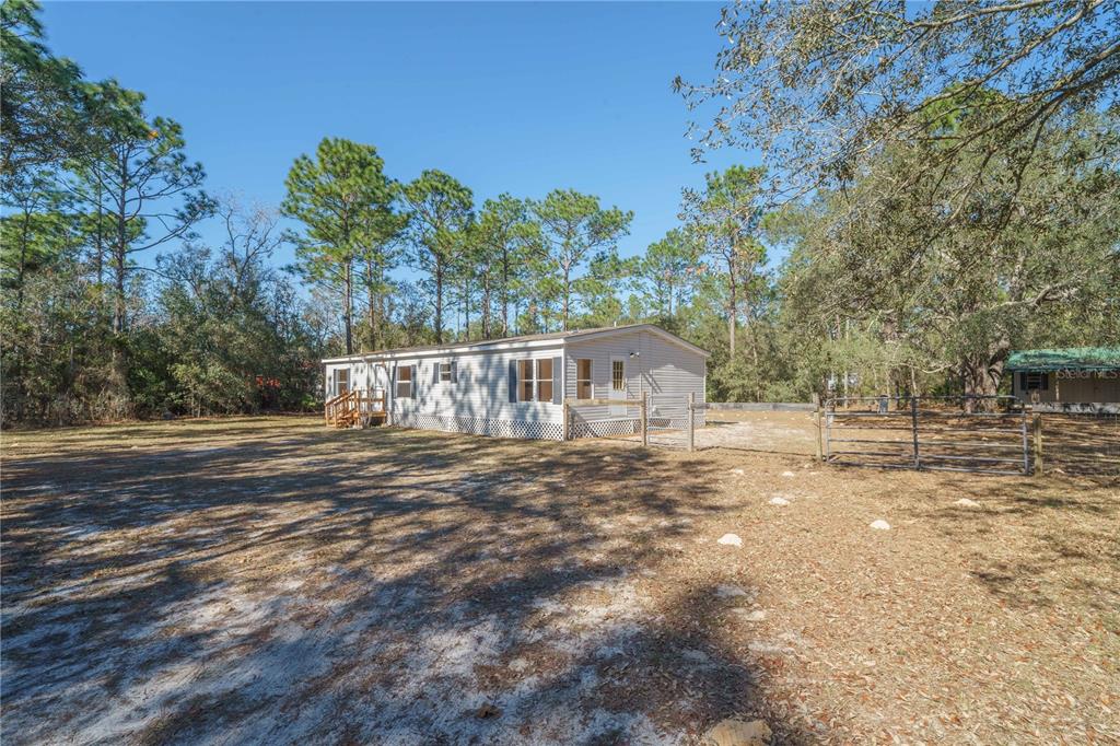 16621 Southwest 45th Street Ocala, FL 34481 - Photo 6 of 52 a view of a yard with large trees