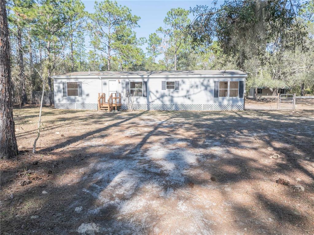 16621 Southwest 45th Street Ocala, FL 34481 - Photo 7 of 52 a view of house with outdoor space and sitting area