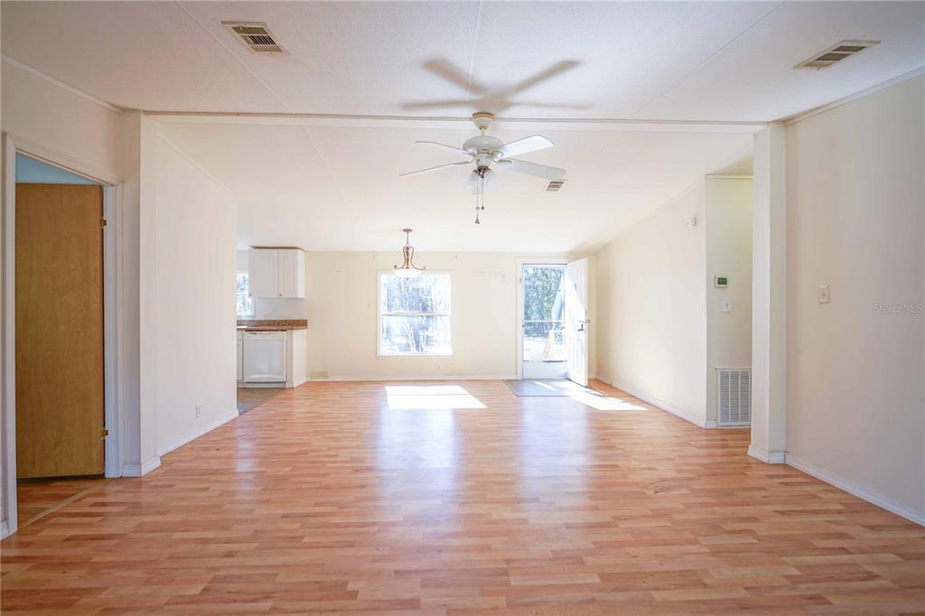 16621 Southwest 45th Street Ocala, FL 34481 - Photo 10 of 52 a view of empty room with wooden floor and fan
