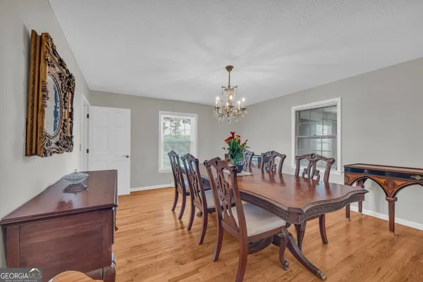 a bathroom with a sink a toilet and a window