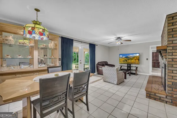 a bathroom with a granite countertop sink a toilet and a mirror