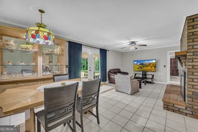 a bathroom with a granite countertop sink a toilet and a mirror