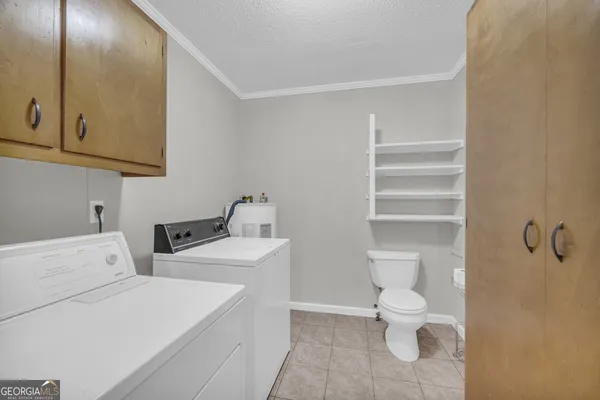 a backyard of a house with a yard and outdoor seating