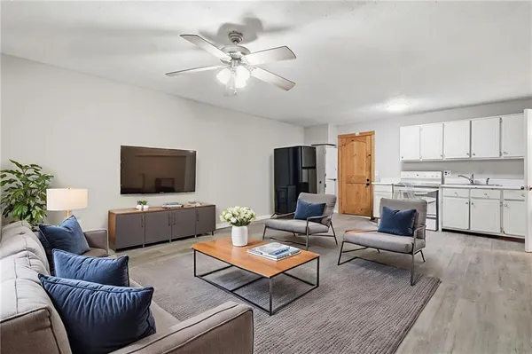 a living room with furniture and a flat screen tv
