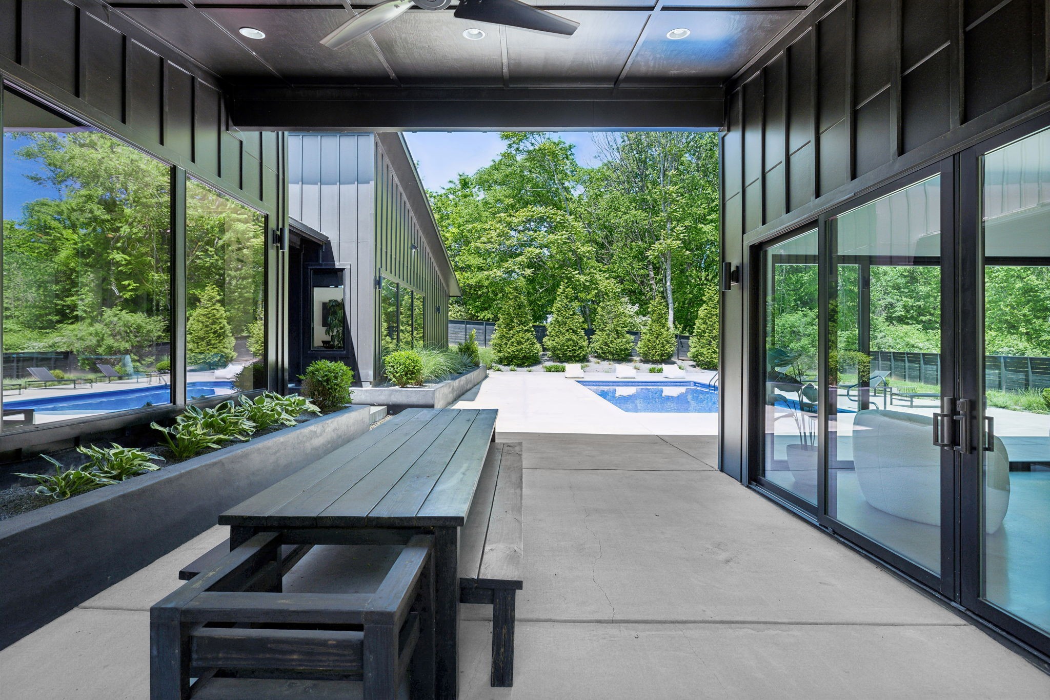 4160 Clovercroft Road Franklin, TN 37067 - Photo 23 of 62 a view of a patio with table and chairs potted plants with floor to ceiling window and potted plants