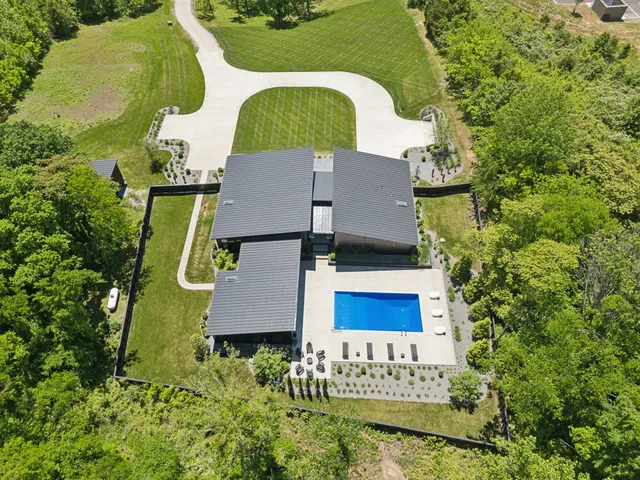 an aerial view of residential house with outdoor space