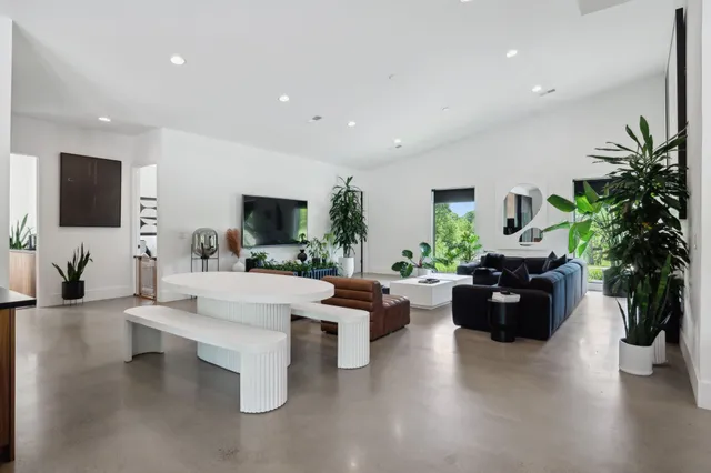 a view of a potted plant in a hall with a window