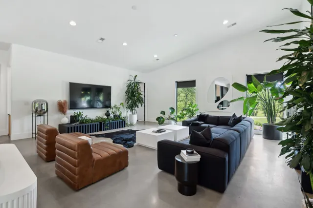 a lobby with furniture and potted plant