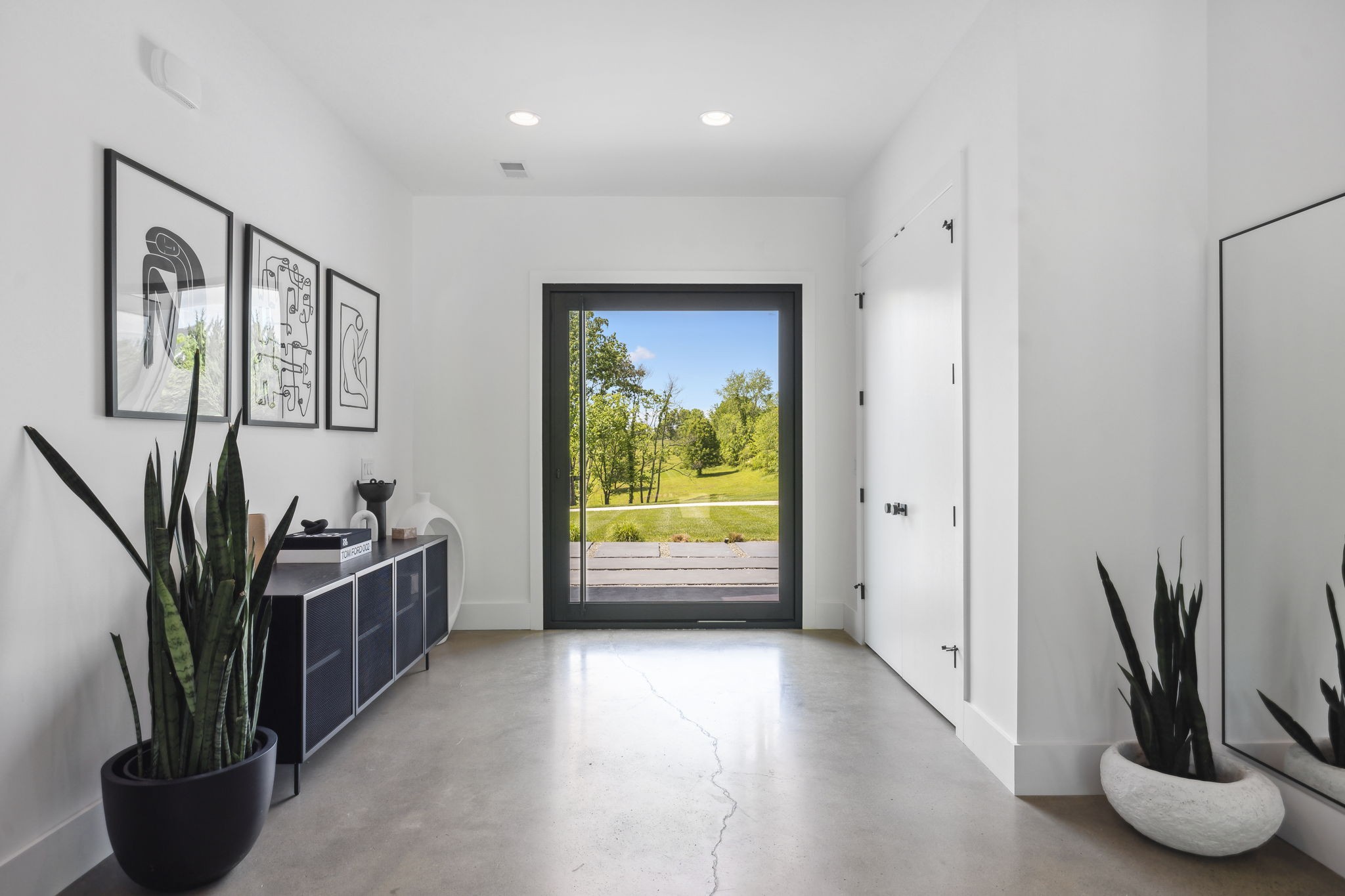 4160 Clovercroft Road Franklin, TN 37067 - Photo 61 of 62 a view of a potted plant in a hall with a window