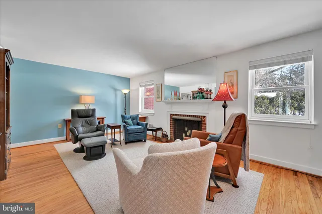 a living room with furniture fireplace and flat screen tv