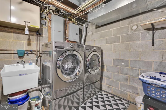 a kitchen with stainless steel appliances a sink stove and cabinets