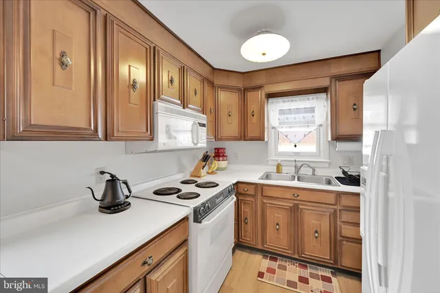 a living room with furniture a fireplace and a table