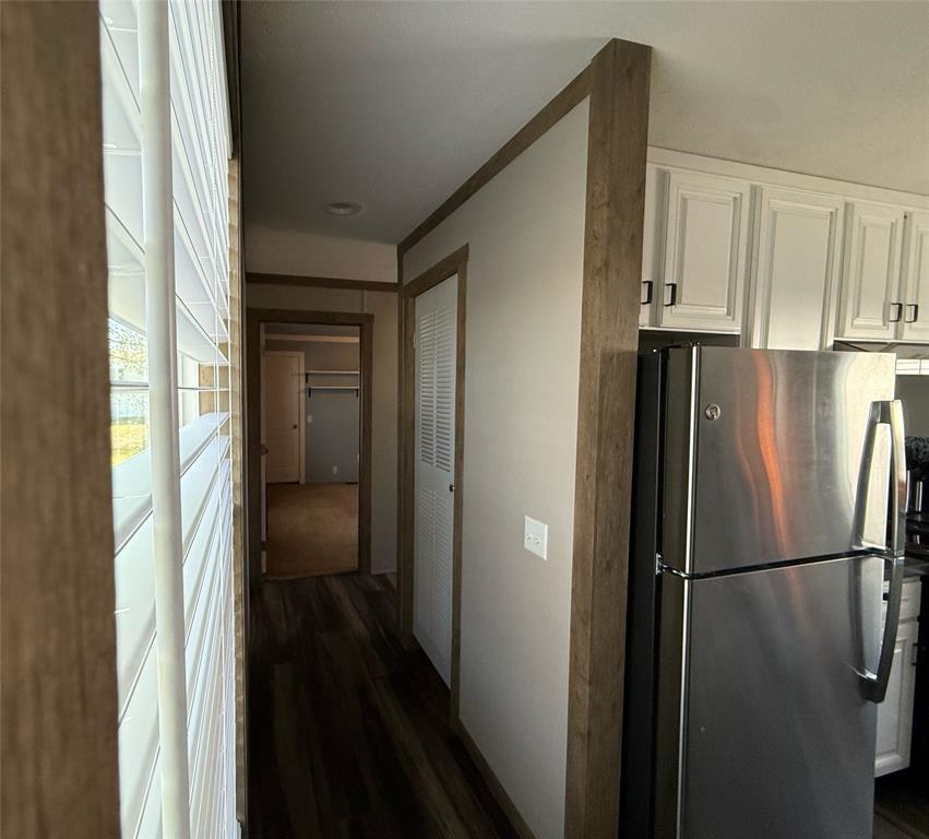 4937 Stuart Road Denton, TX 76207 - Photo 3 of 19 a view of a kitchen from a hallway