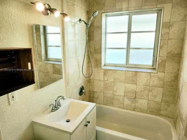 a bathroom with a sink and a bathtub