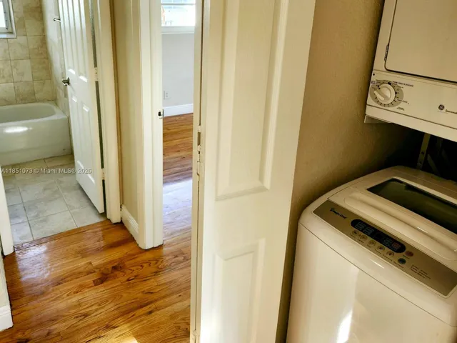 a utility room with washing machine