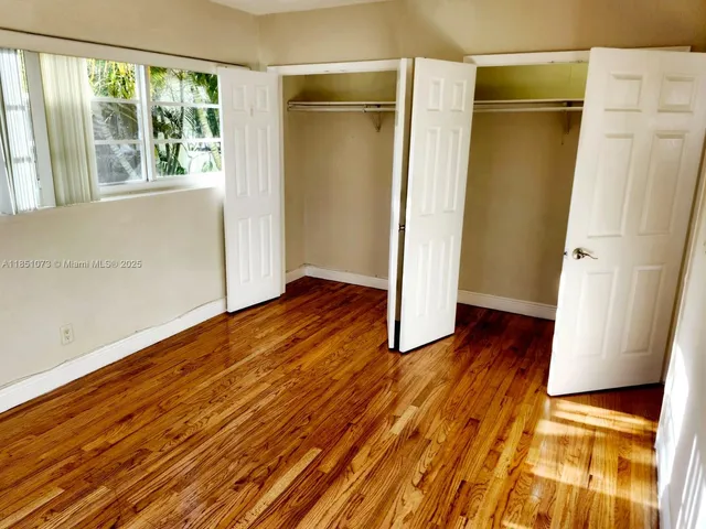 a view of front door with wooden floor