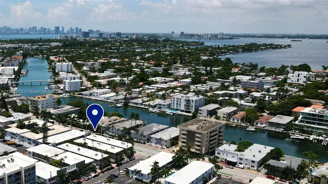 an aerial view of a city with lots of residential buildings ocean and ocean view