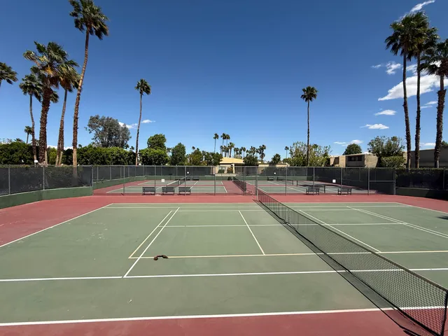 a view of an outdoor space and tennis court