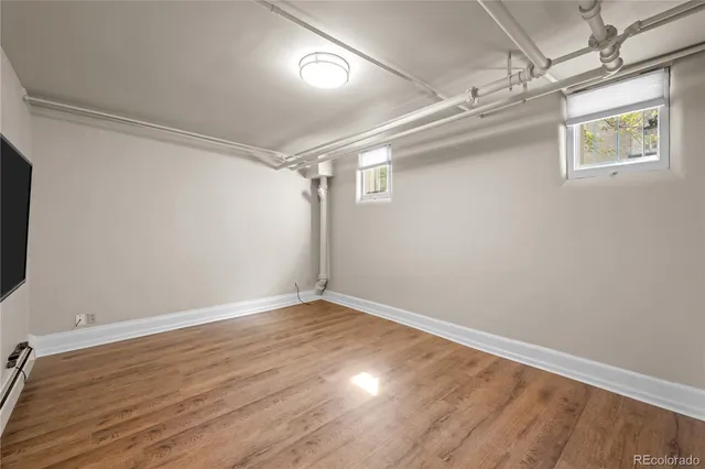 a view of room with wooden floor