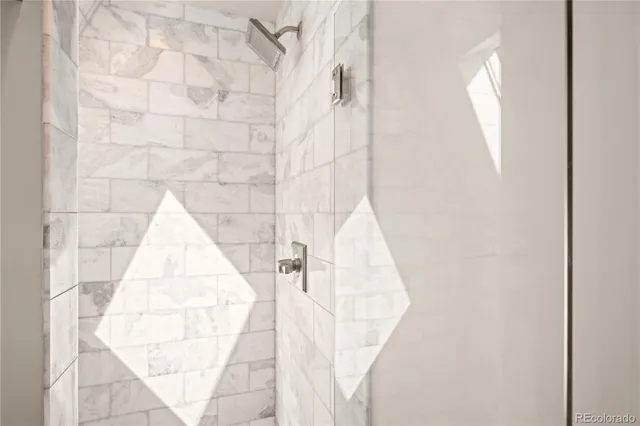 an entryway with white walls and a window