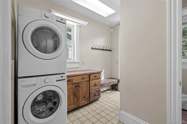 a view of a storage and utility room with washer and dryer