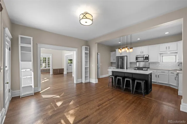 a kitchen with a table and chairs in it