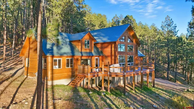 a view of multiple houses with a yard