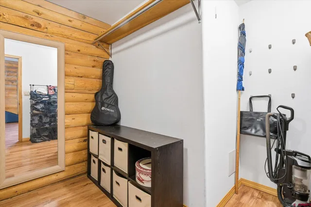 a bedroom with a bed and a desk