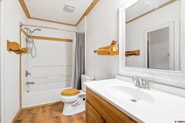 a view of walk in closet with clothes