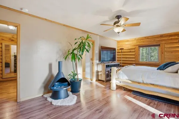 a living room with furniture and large windows