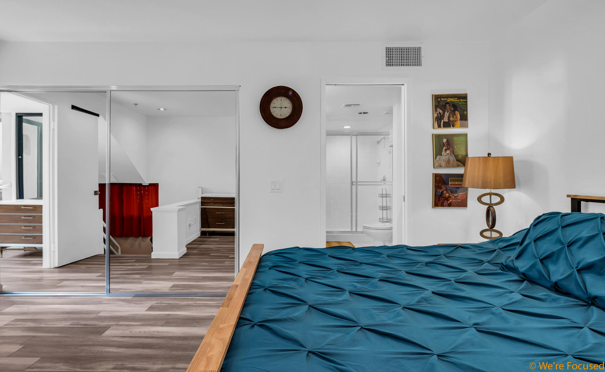 100 East Stevens Road, Unit 507 Palm Springs, CA 92262 - Photo 12 of 25 a bedroom with a bed and a table with wooden floor
