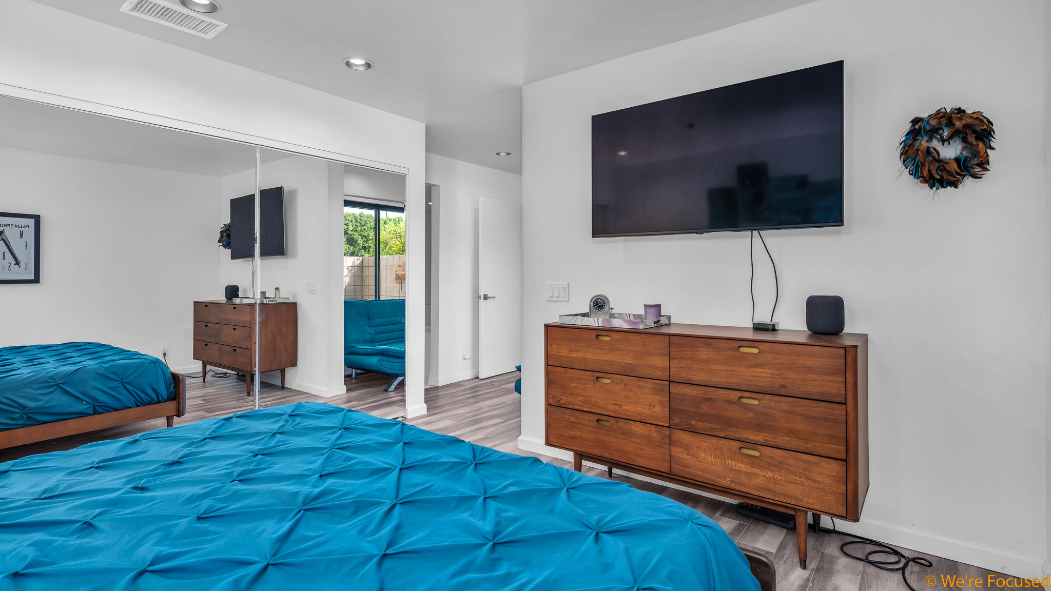 100 East Stevens Road, Unit 507 Palm Springs, CA 92262 - Photo 19 of 25 a bedroom with a bed and a flat screen tv