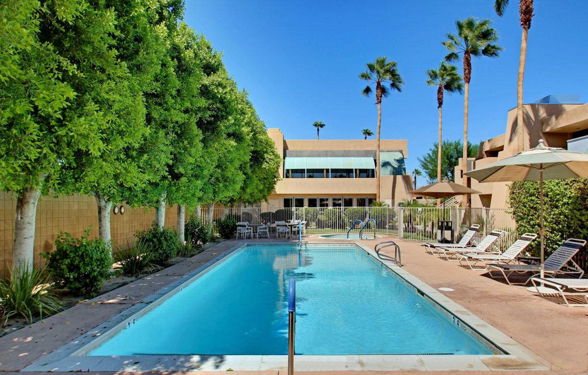 100 East Stevens Road, Unit 507 Palm Springs, CA 92262 - Photo 22 of 25 a view of a swimming pool with a patio