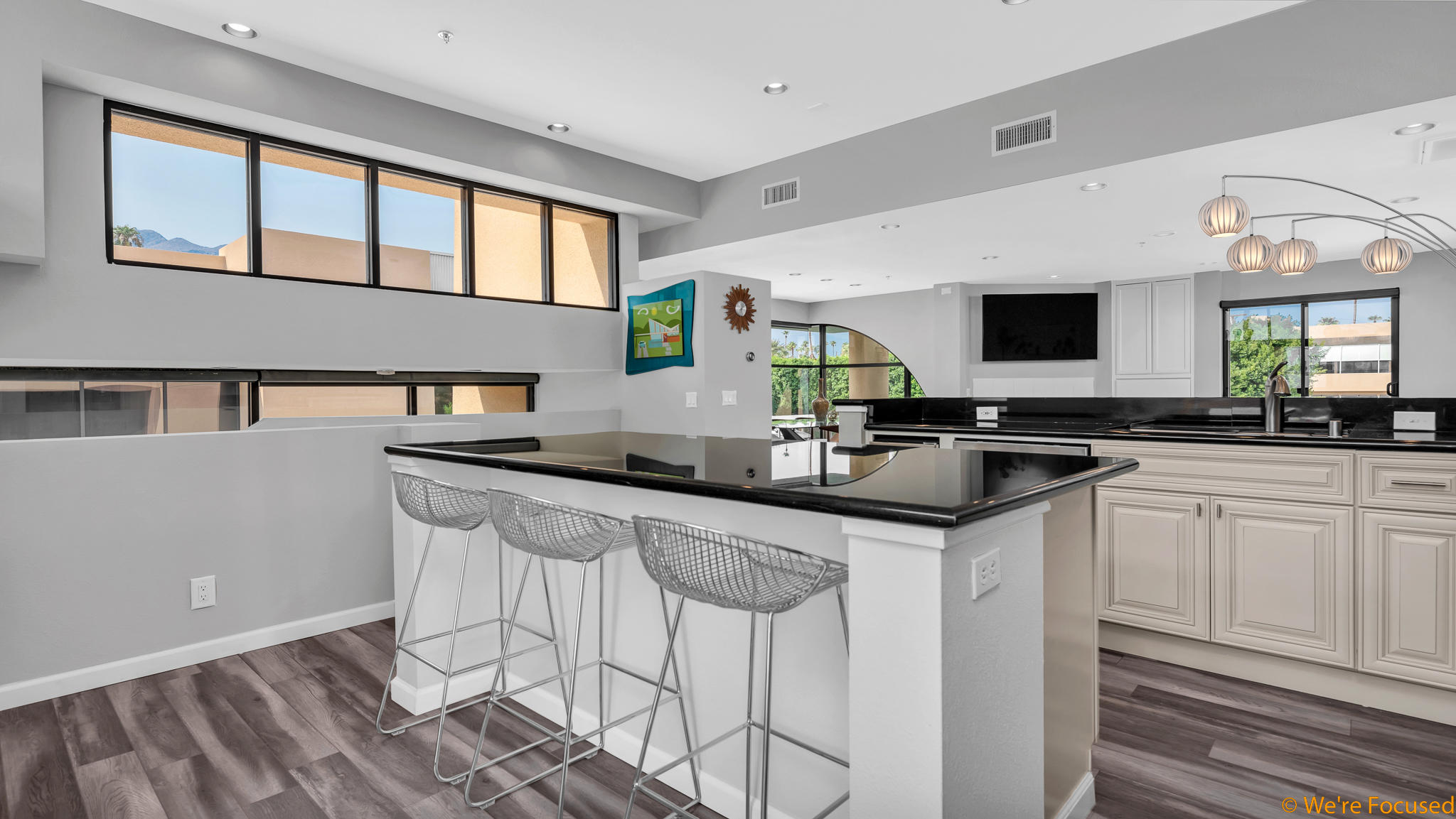 100 East Stevens Road, Unit 507 Palm Springs, CA 92262 - Photo 9 of 25 a kitchen with granite countertop a sink and a white cabinets