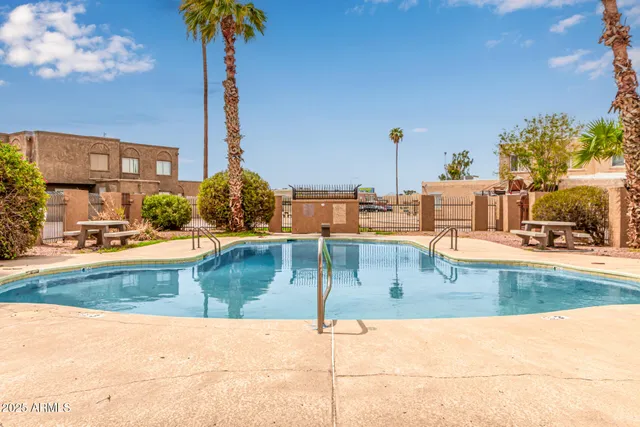 a view of a swimming pool with a lounge chairs