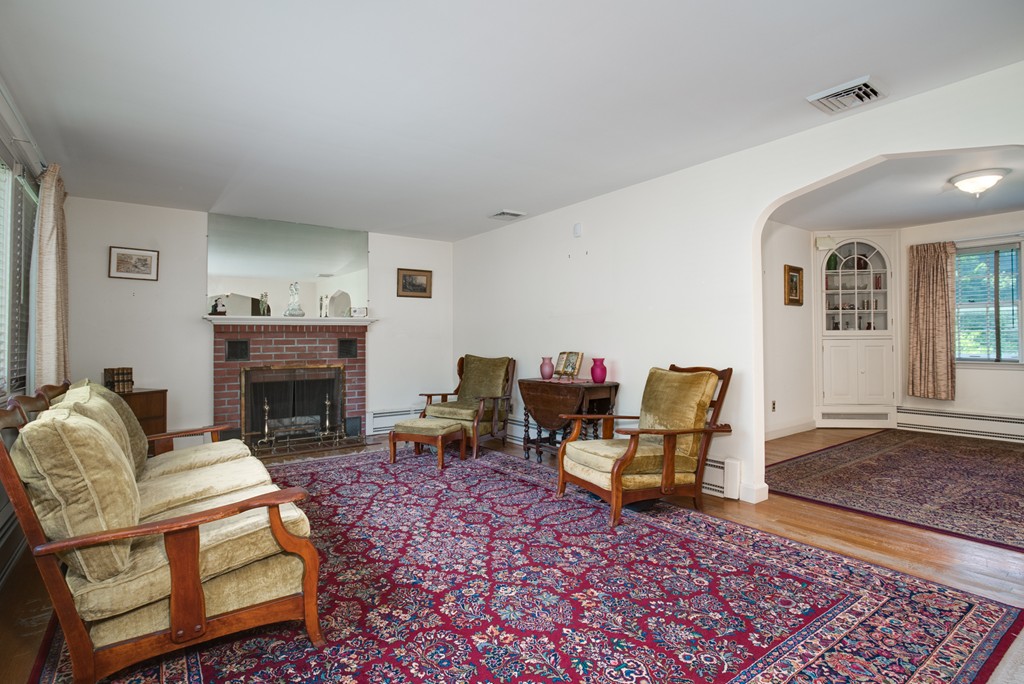 53 Kinnicutt Road Worcester, MA 01602 - Photo 11 of 30 a living room with furniture and a fireplace