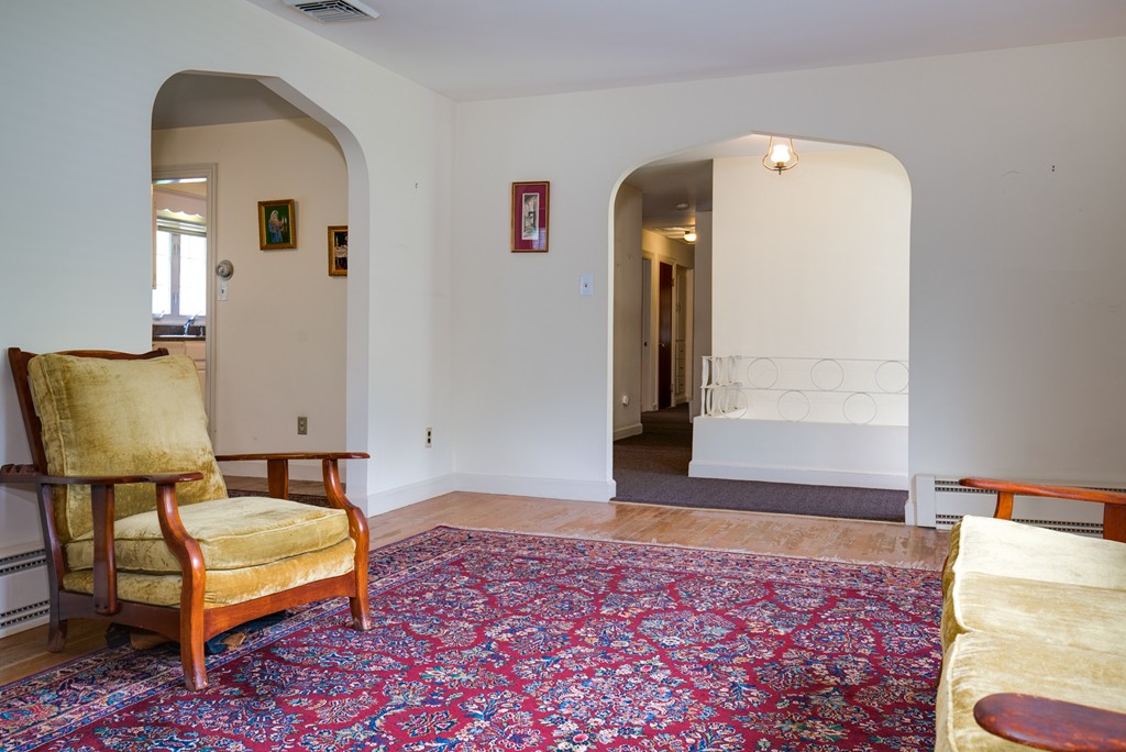 53 Kinnicutt Road Worcester, MA 01602 - Photo 13 of 30 a spacious bedroom with a bed and a lamp on dresser