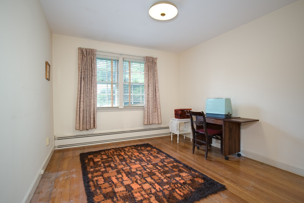 53 Kinnicutt Road Worcester, MA 01602 - Photo 20 of 30 a view of a workspace with furniture and a window