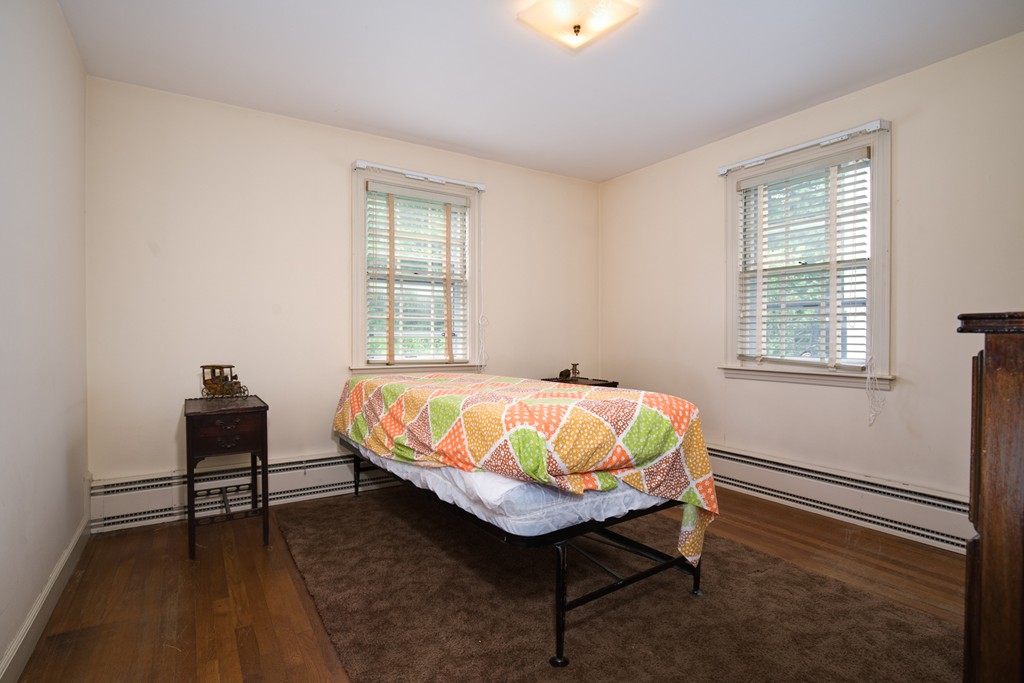53 Kinnicutt Road Worcester, MA 01602 - Photo 21 of 30 a bedroom with a bed and a window