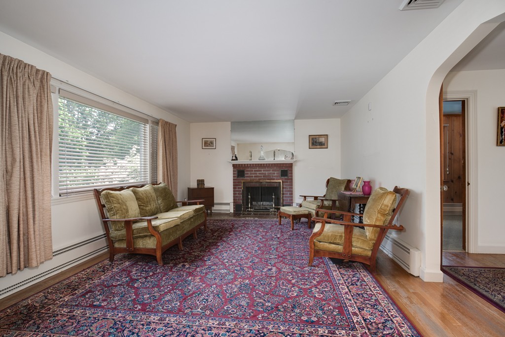 53 Kinnicutt Road Worcester, MA 01602 - Photo 10 of 30 a living room with furniture and a fireplace