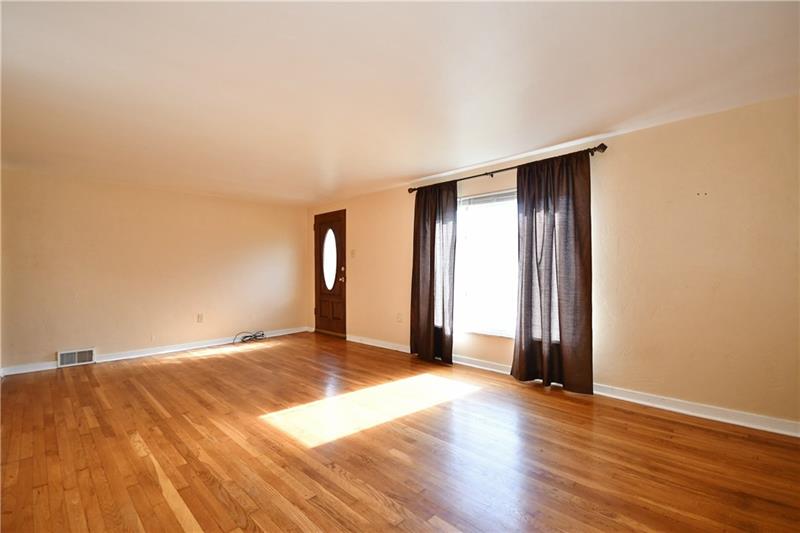 340 Ewing Road Carnegie, PA 15106 - Photo 5 of 24 Large Light and bright Living room w/hardwood floors, large front picture window~