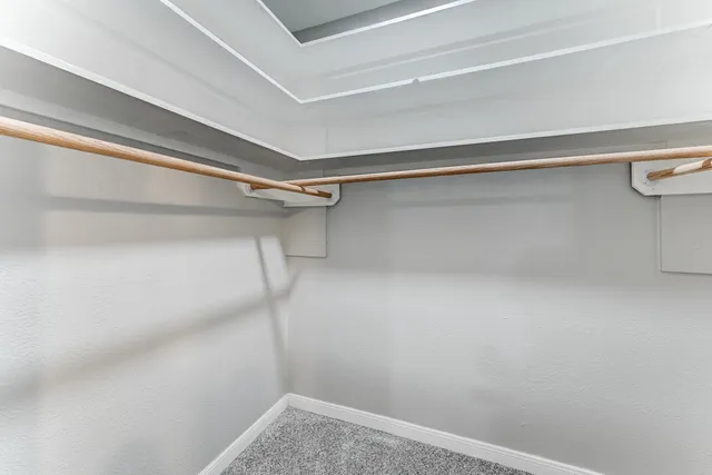 a view of an empty walk in closet