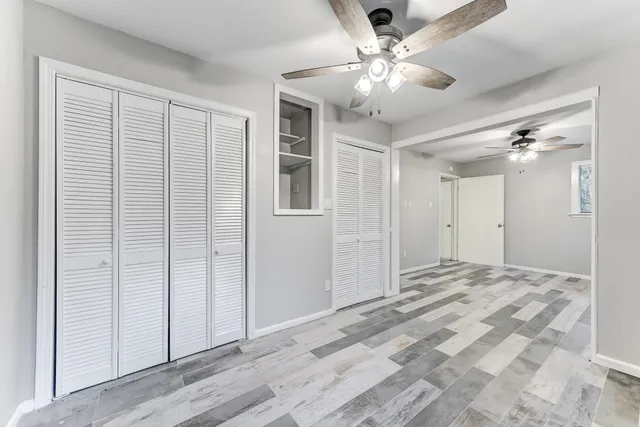 a view of a livingroom with a chandelier fan